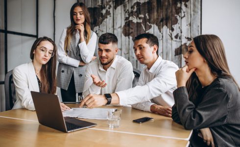 Group of people working out business plan in an office